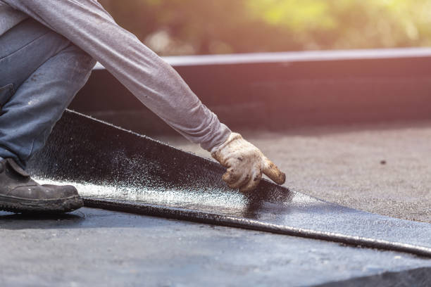 Professional Basement Waterproofing technician working in Oakville, IN
